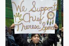 Woman with sign supporting chief Teresa Spence