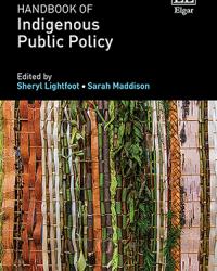 Book cover for Handbook of Indigenous Public Policy, edited by Sheryl Lightfoot and Sarah Maddison. The cover features vertical bands of woven natural materials in earthy tones—greens, browns, and tans—set against a dark background, with the publisher Edward Elgar listed at the top.