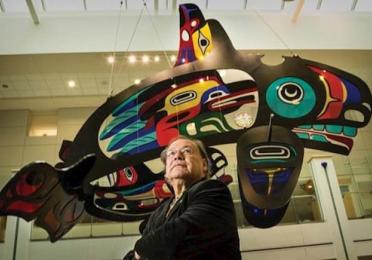 Marvin Oliver in front of his installation Mystical Journey, at Seattle Children's Hospital Marvin Oliver in front of his installation Mystical Journey, hanging glass whale in Seattle Children's Hospital