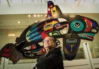 Marvin Oliver in front of his installation Mystical Journey, at Seattle Children's Hospital Marvin Oliver in front of his installation Mystical Journey, hanging glass whale in Seattle Children's Hospital